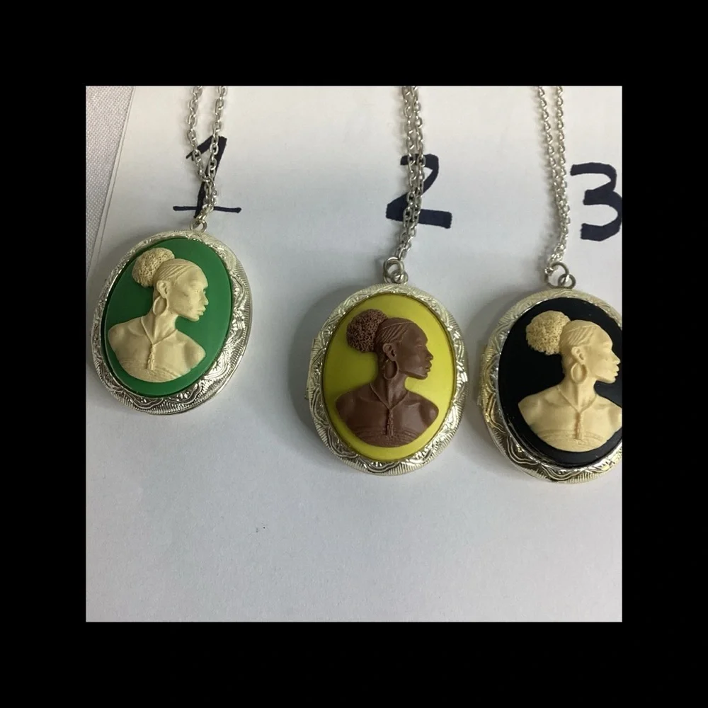 Multicolor raised cameo locket.